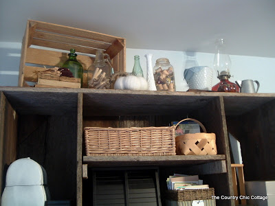 decorations above aged wood hutch
