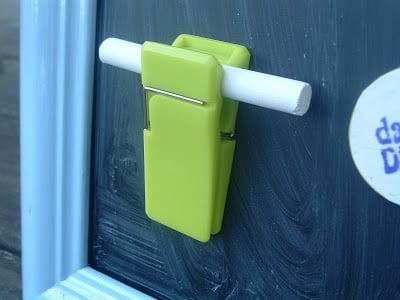 Use a plain kitchen clip as a chalk holder for your magnetic calendar