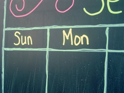 Creating a magnetic chalkboard calendar using chalk markers.