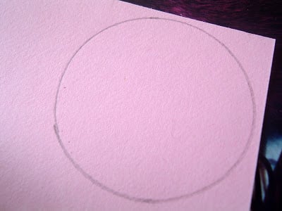 Trace a circle onto craft paper, then cut.