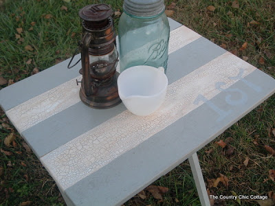 painted tray table with lantern and white cup; vintage mason jar