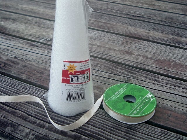 styrofoam cone with ribbon on wood