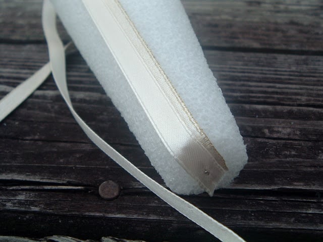 pinning ribbon on a foam cone