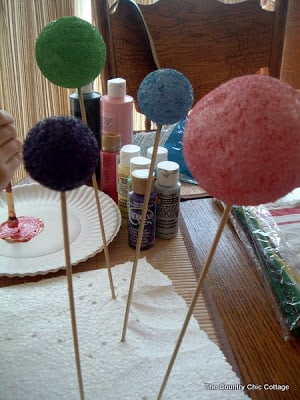 painted styrofoam balls on a stick