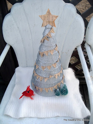 The Stak Decorated Christmas Tree on outdoor chair