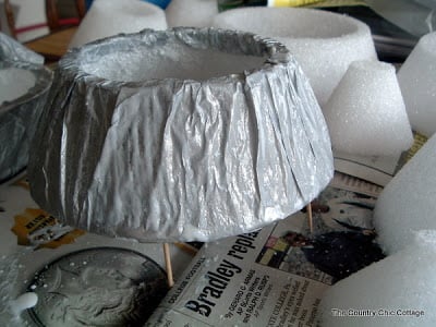 tooth picks holding up mod podged silver styrofoam ring