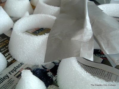 styrofoam rings with silver tissue paper