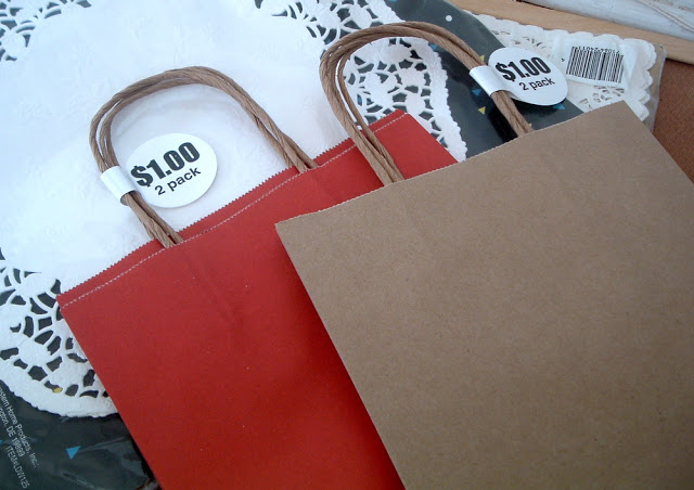 red and brown gift bags with paper doilies