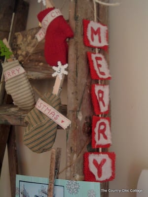 Merry red glitter burlap Christmas banner on an antique ladder