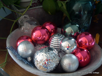 red and silver ornaments in a bowl