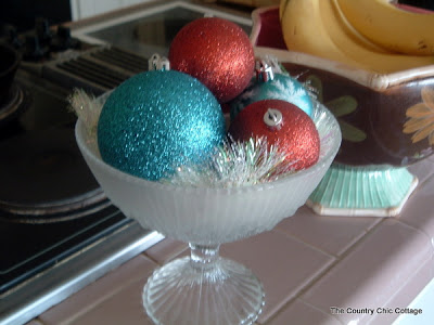 glitter ornaments in a candy dish