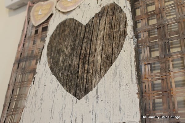 Barn wood painted white with heart shape in center