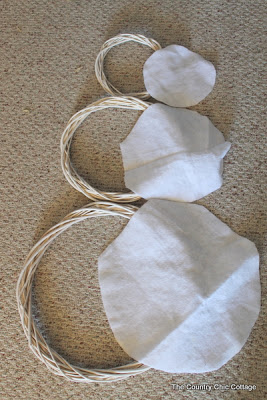 grapevine wreaths painted white with white felt circles