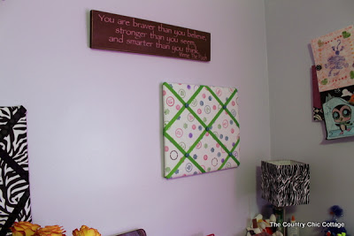 fabric bulletin board hung in a teen girls room 
