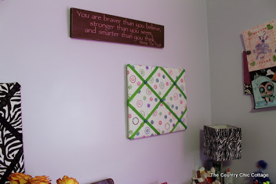 fabric bulletin board hung in a teen girls room