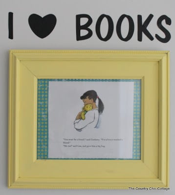 I heart books in vinyl with framed book page under it.