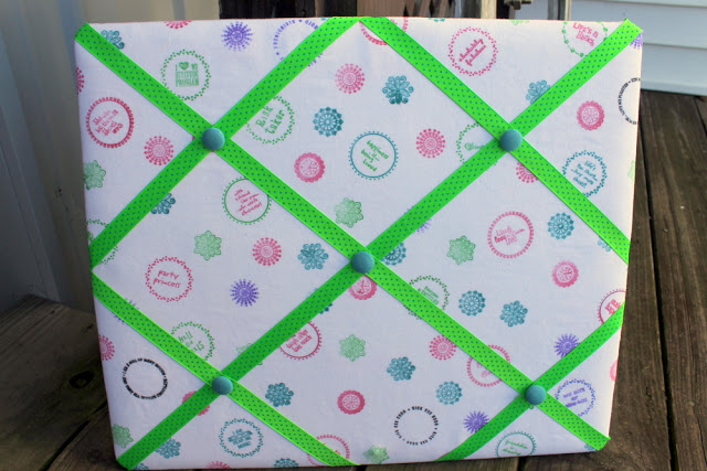 stamped memo board with green ribbon 