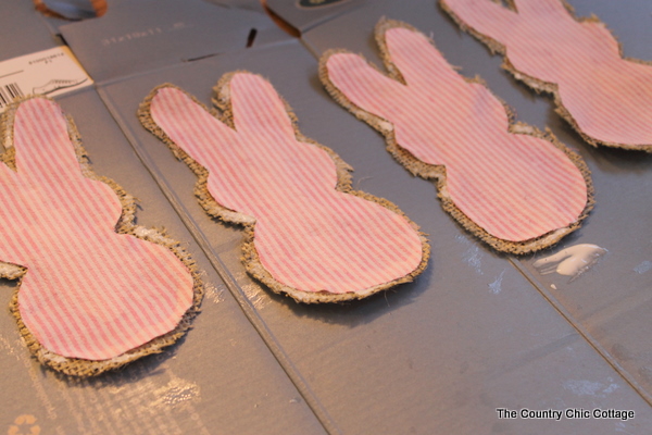 bunny-shaped fabric cutouts glued to burlap