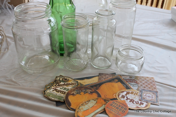 old bottles and jars on a table with labels