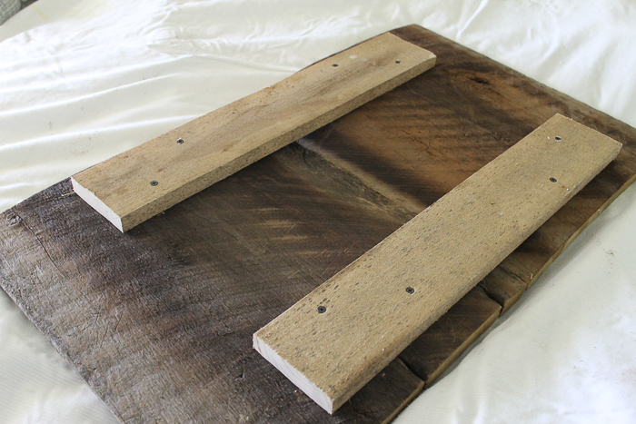 assembling a wood sign with nails