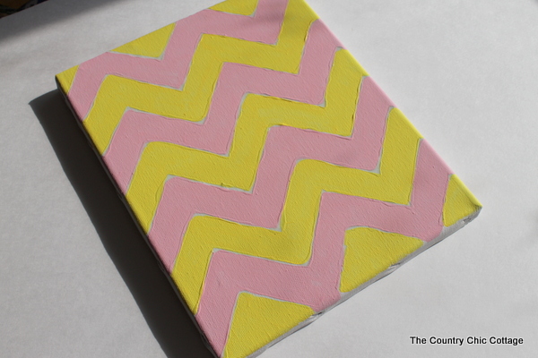 rainy day kids craft canvas art using glue as a paint mask