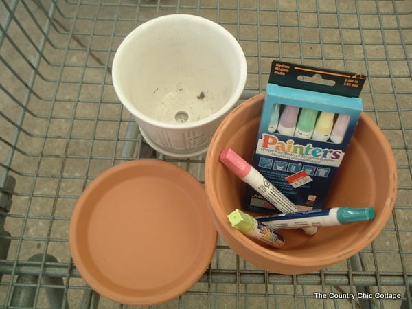 Painter paint pens and flower pots in Walmart shopping cart