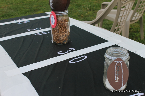 Football field table cloth for sports-themed birthday party.