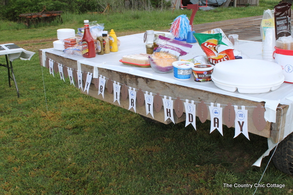 Finished sports-themed birthday party table with happy birthday banner.