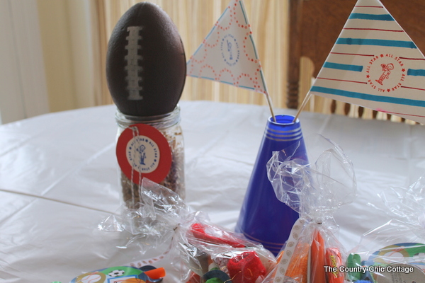 Sports-theme birthday party paper flags added to cheer cones.