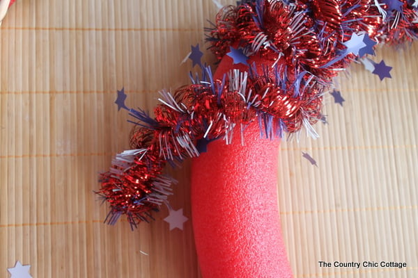 wrapping garland around pool noodle