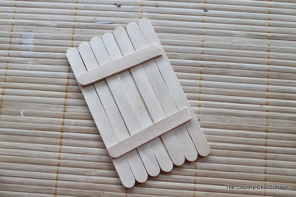 July 4th wreath decor gluing popsicle sticks