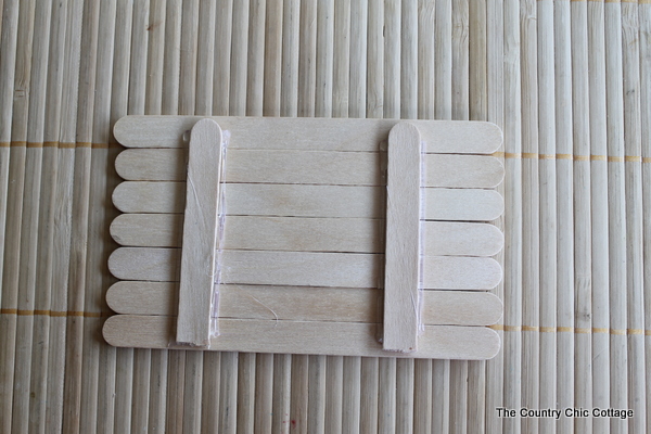July 4th wreath decor gluing popsicle sticks
