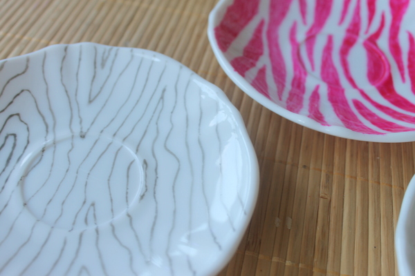 patterned painted plates on wooden table