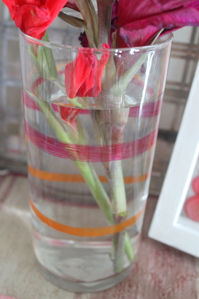 Clear glass vase with orange and red stripes
