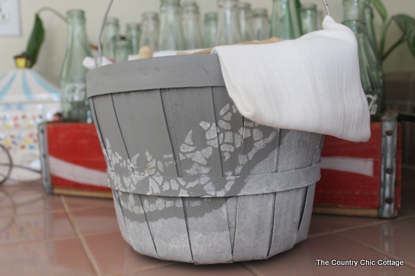 gray and white basket with flour sack towel