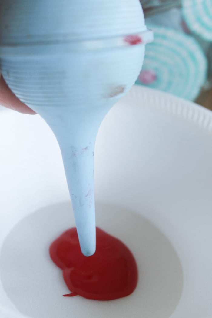 I used a baby nose syringe to splatter the red, white, and blue paint around the inside of my mason jar