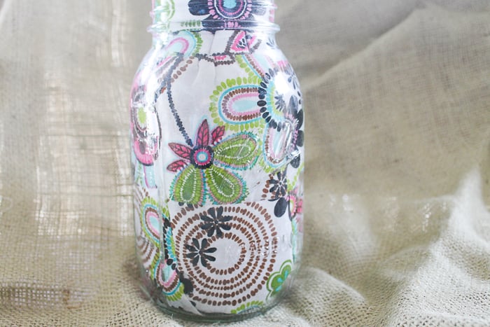 This floral decoupaged mason jar is perfect for storage of any kind!