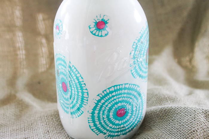 This painted mason jar with floral fabric is perfect for simple decor around your home