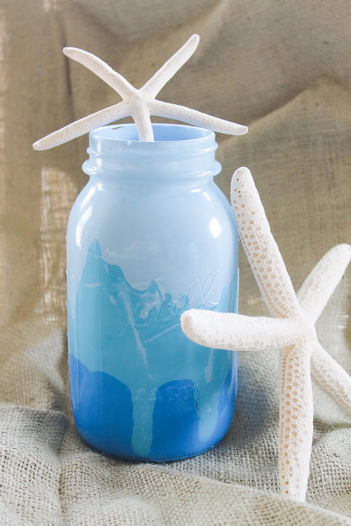 This pretty blue ombre mason jar would be the perfect addition to any beach themed decor
