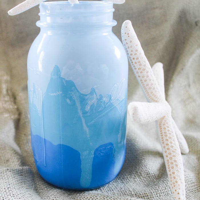 This beautiful blue painted mason jar is perfectly beachy decor