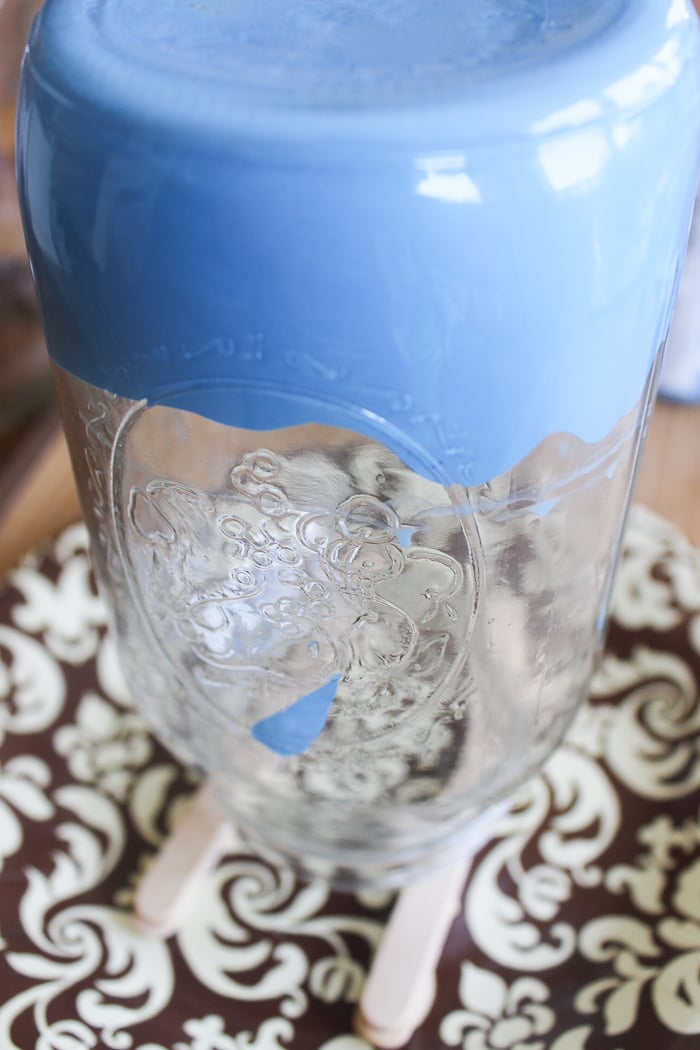 Simply turn the mason jar glass around, until the dark blue paint covers the bottom third of your mason jar