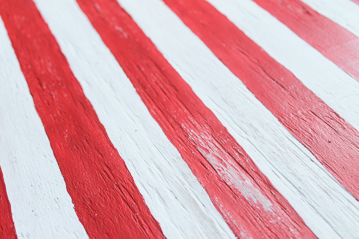 Use sandpaper to distress painted wooden American flag