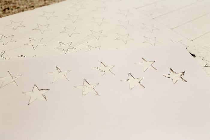 a stars stencil cut with a Cricut machine will help make the stars for the American flag design