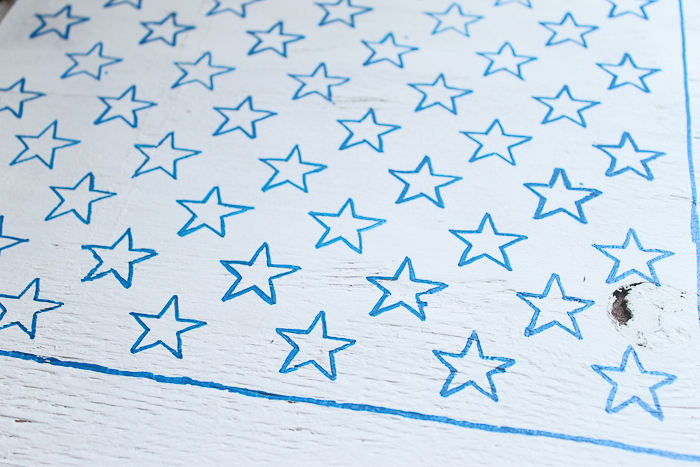 stars outlined with a paint pen, ready to be filled in with blue paint