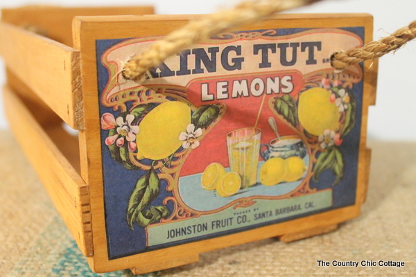 front of a vintage crate with king tut lemons label.