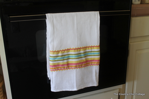 striped flour sack towel hanging on oven door