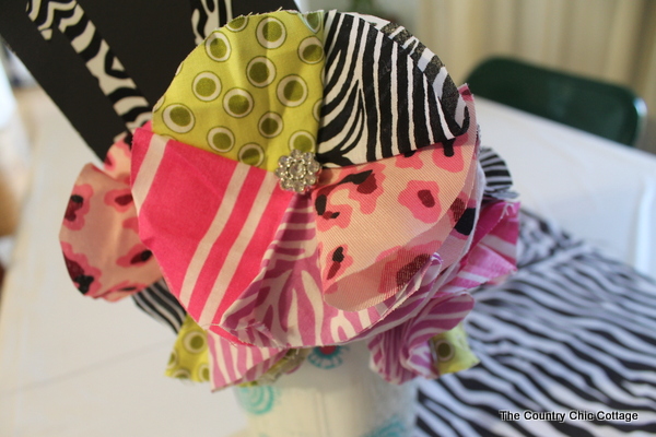 multi color fabric flower in a fabric covered vase