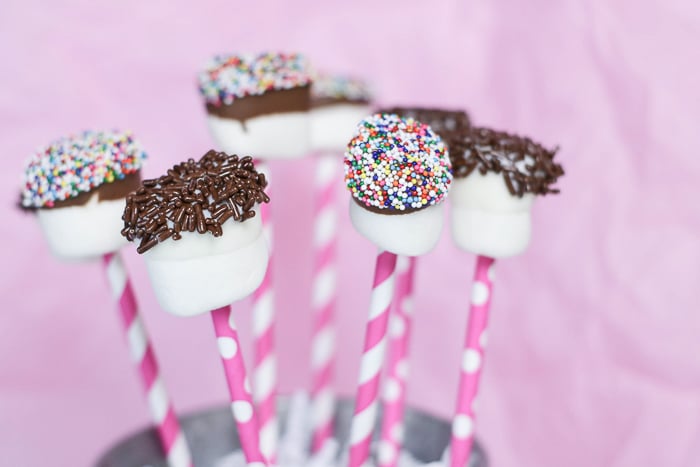 There are so many ways to customize these chocolate dipped marshmallow pops with your favorite toppings!