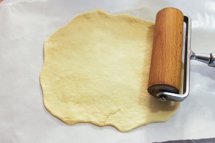 rolling out biscuit dough