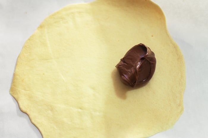 Adding Nutella to biscuit dough to make Nutella fried pies.